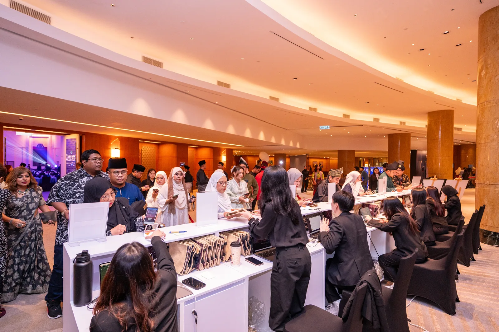 Wide view of a gala event registration with multiple check-in counters